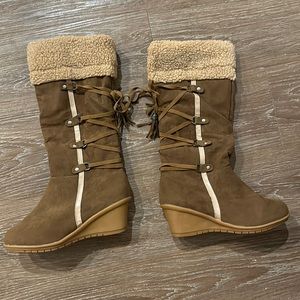 Brown wedge boots with light brown fur at the top